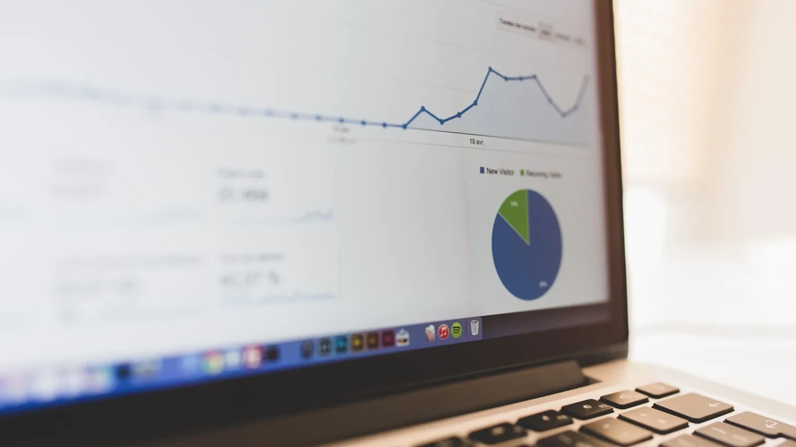 Laptop displaying a property report on a desk