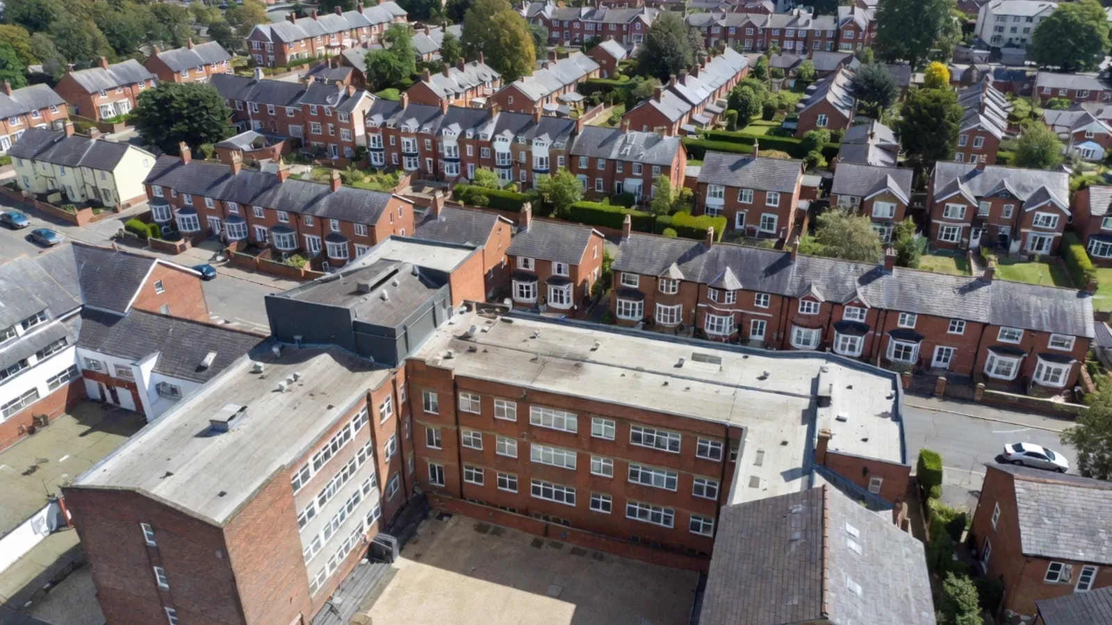 Aerial view of suburban brick houses with streets
