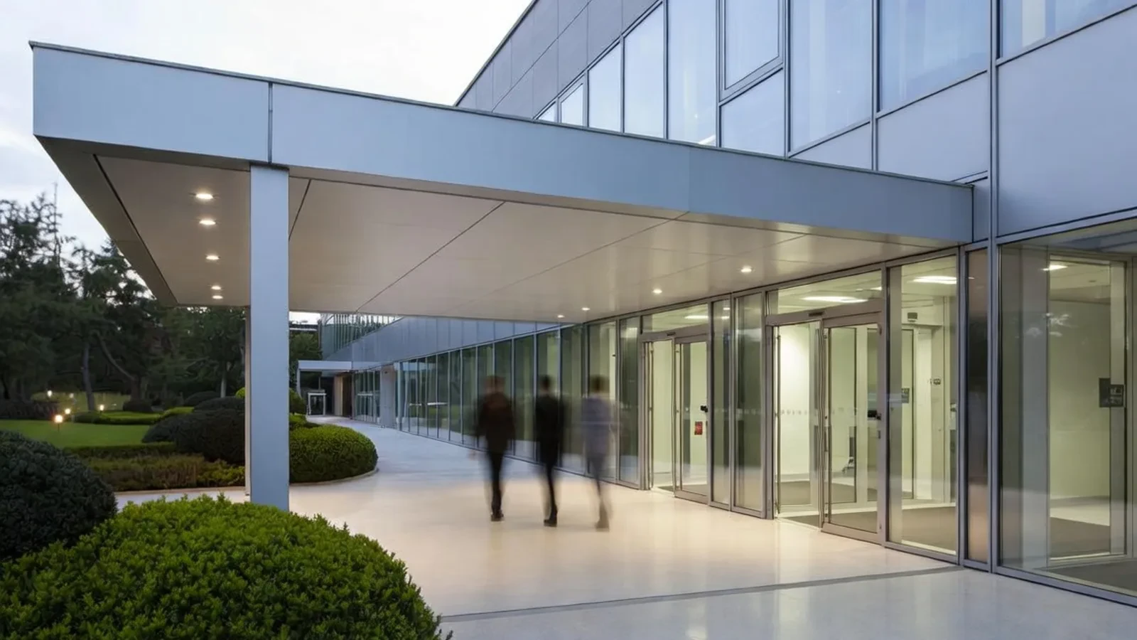 Modern entrance canopy with people walking