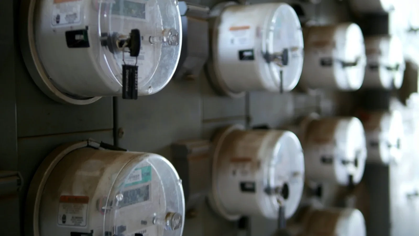 Utility meters arranged in a service cupboard