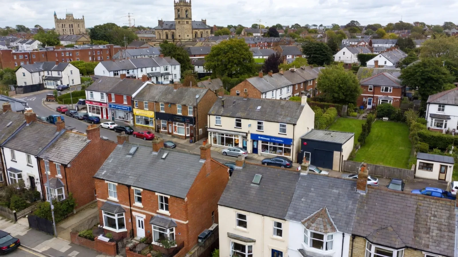 East Midlands neighbourhood with homes, commercial buildings and a city skyline
