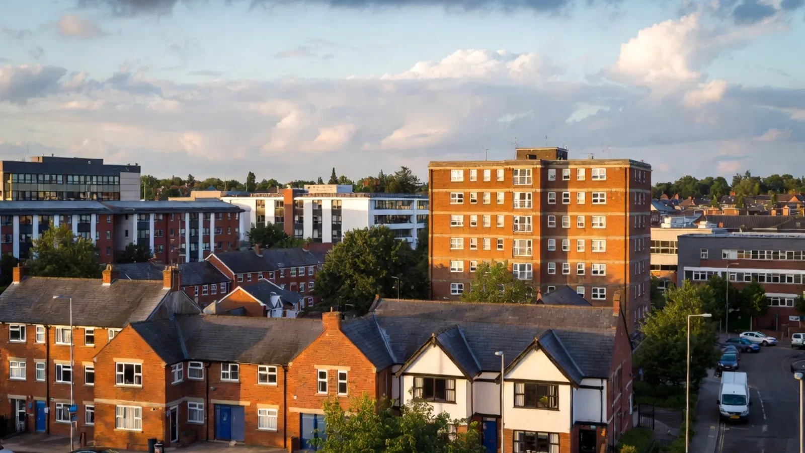 Residential area at sunset with brick and white houses