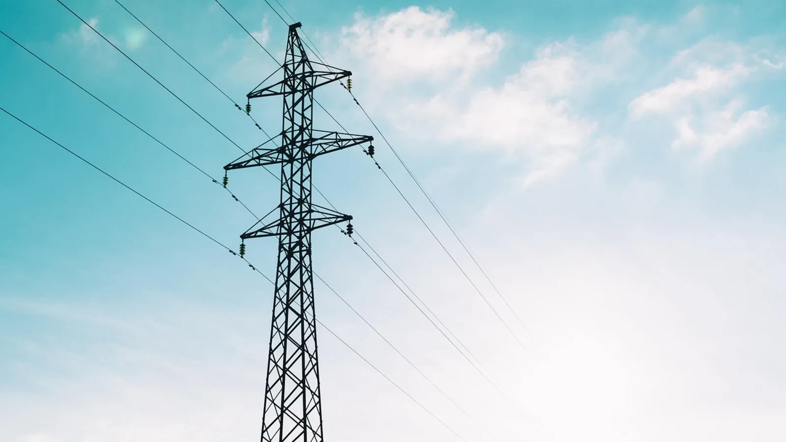 Electricity transmission tower against a clear sky